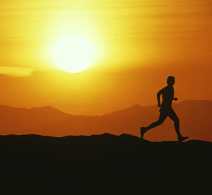 Man running at sunset