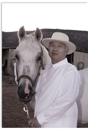 Ilchi Lee with a horse