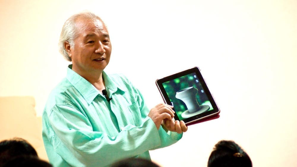 Ilchi Lee holding an iPad