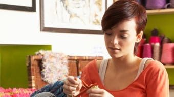 young woman knitting