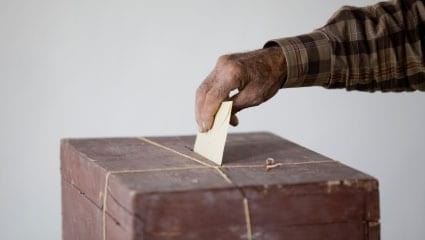 Hand casting a ballot