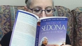 woman reading The Call of Sedona by Ilchi Lee