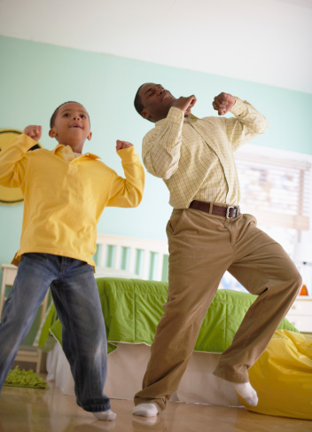 Father and Son Dancing at Home