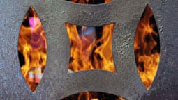 fire behind a metal grate