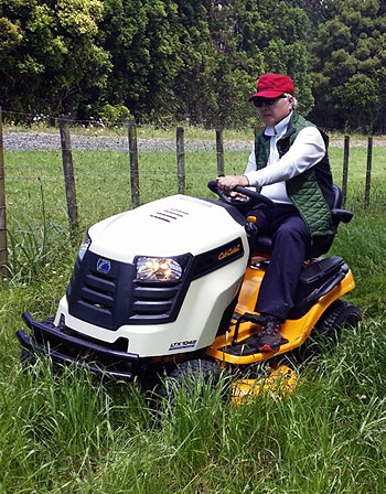 Ilchi Lee cutting grass