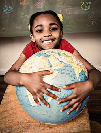 child hugging a globe