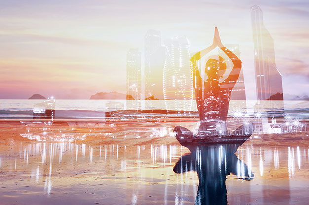 Peace in the brain | a woman meditating in front of a cityscape