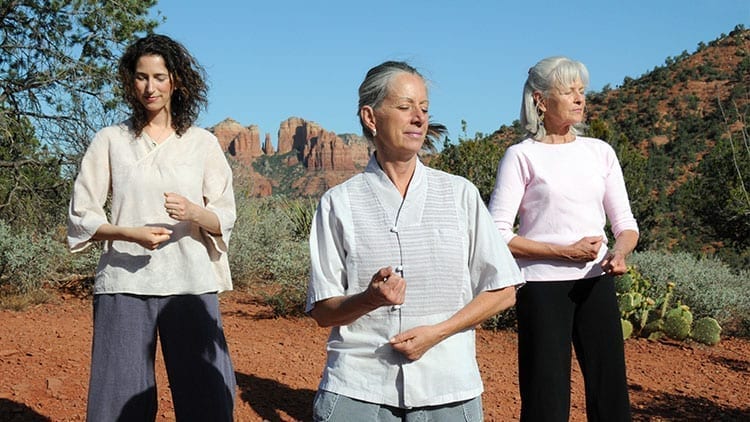 3 women doing Ilchi Lee's Brain Wave Vibration technique