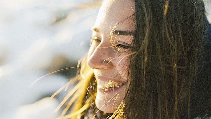 closeup of young woman's face in the snow