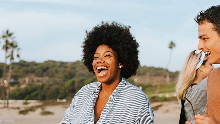 woman singing on the beach