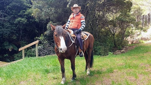 Ilchi Lee on horseback