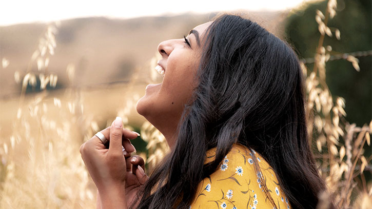 Young Indian woman laughing