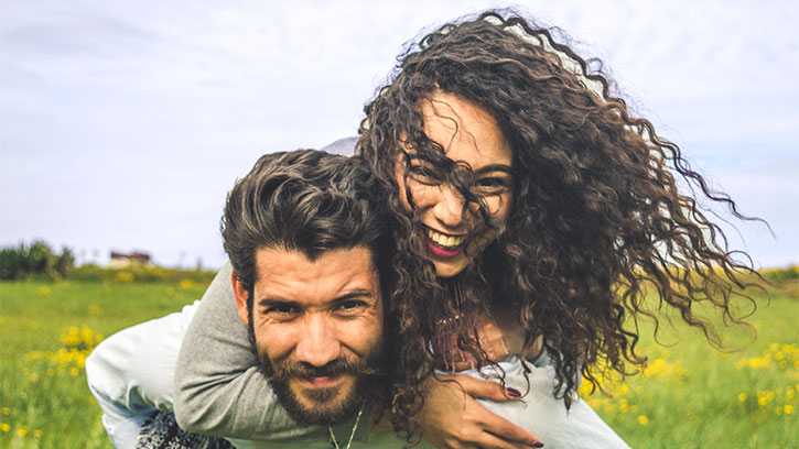 young couple back hug