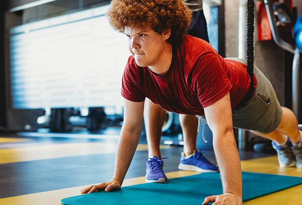 young man doing push-ups