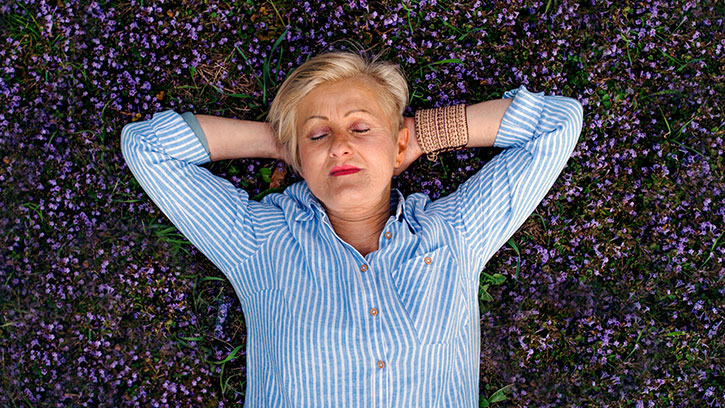 woman lying on lavender field