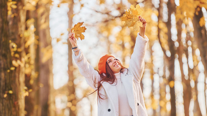 woman among autumn leaves